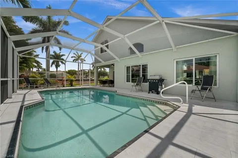 a view of a house with backyard porch and patio