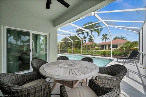 a spacious bedroom with a bed and wooden floor