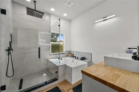 a bathroom with a sink and shower