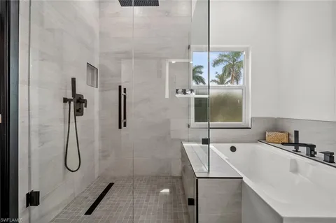 a bedroom with a bed and a desk