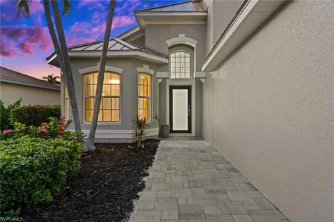 an aerial view of a pool patio yard and outdoor seating
