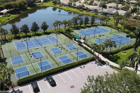an aerial view of a house with a lake view