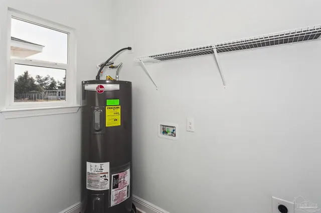 a bathroom with a toilet and a shower curtain