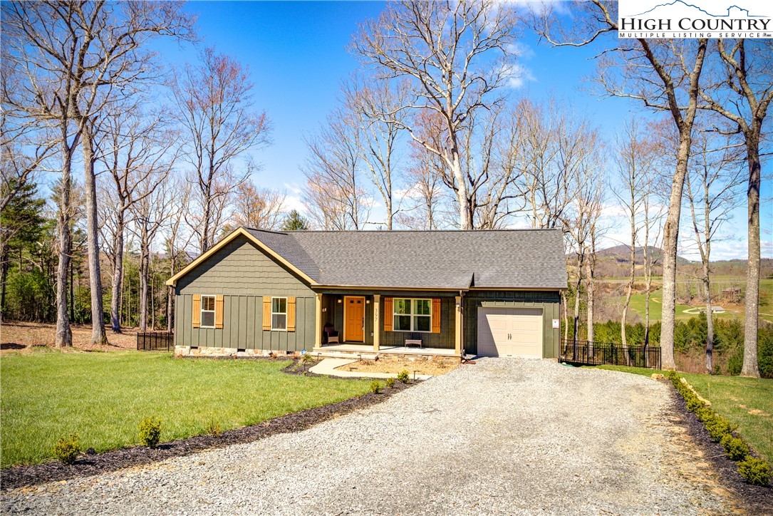 397 Turtle Ridge Road Sparta, NC 28675 - Photo 1 of 33 a front view of a house with a garden