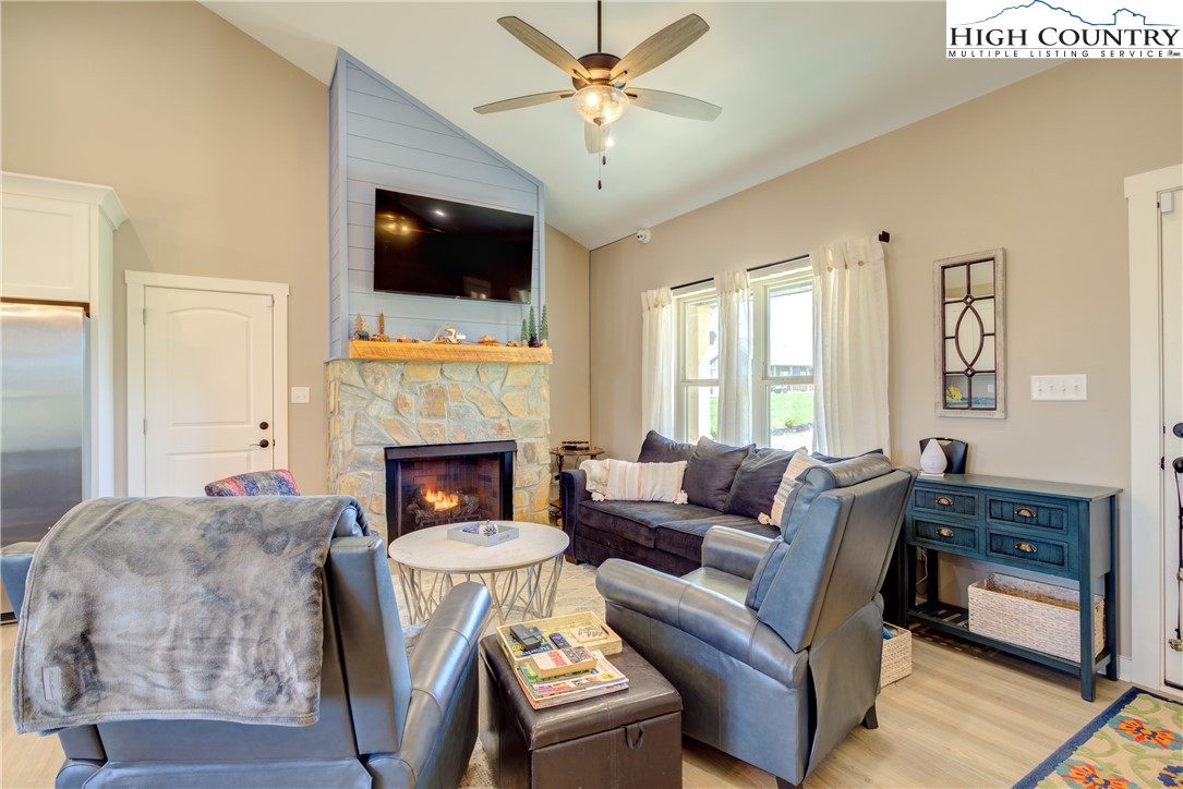 397 Turtle Ridge Road Sparta, NC 28675 - Photo 17 of 33 a living room with furniture fireplace and flat screen tv