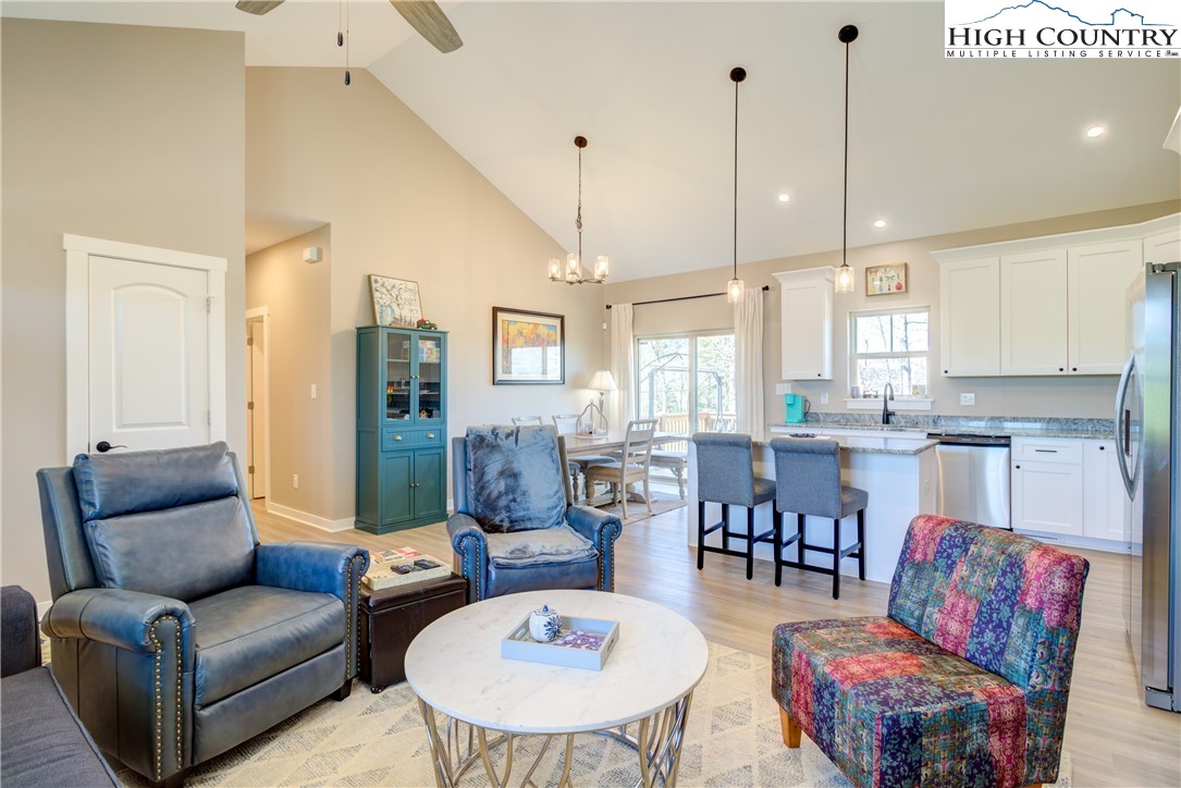 397 Turtle Ridge Road Sparta, NC 28675 - Photo 18 of 33 a living room with furniture and wooden floor