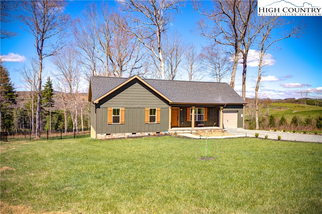 397 Turtle Ridge Road Sparta, NC 28675 - Photo 2 of 33 a front view of a house with a yard