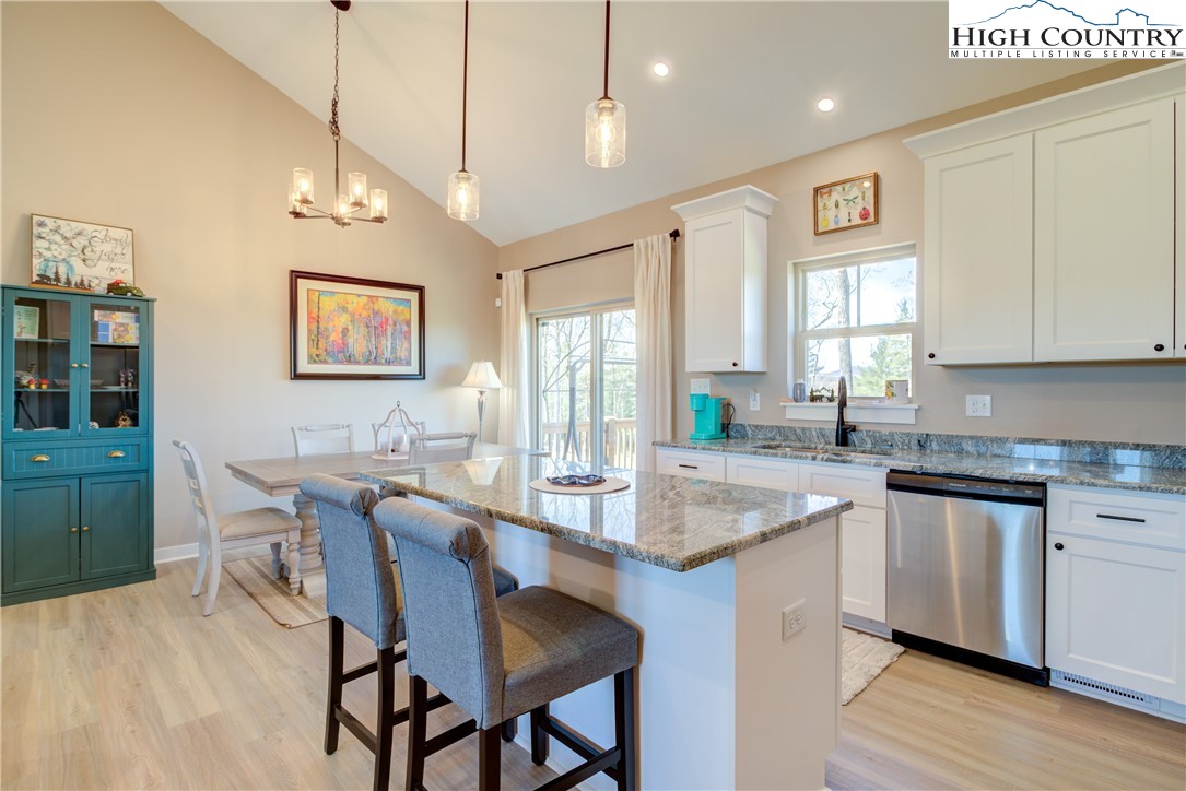 397 Turtle Ridge Road Sparta, NC 28675 - Photo 21 of 33 a dining table with chairs and cabinets