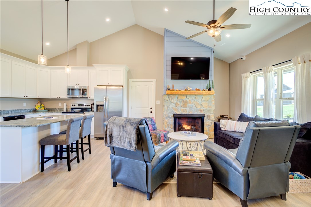 397 Turtle Ridge Road Sparta, NC 28675 - Photo 24 of 33 a living room with furniture fireplace and flat screen tv