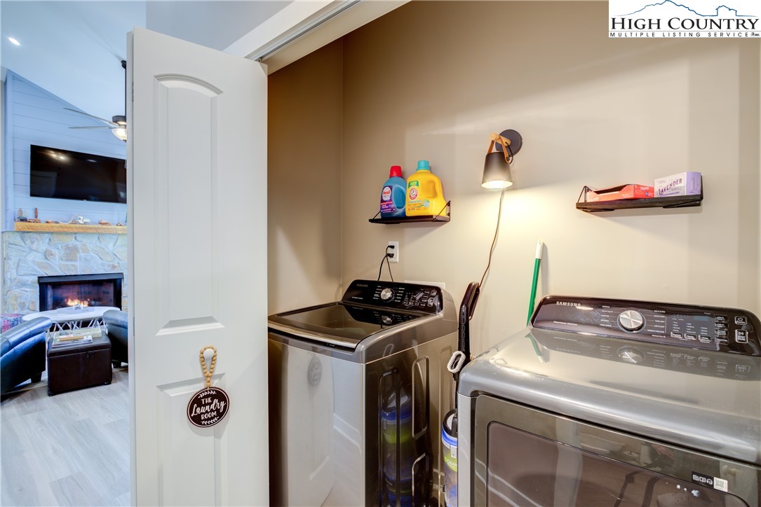 397 Turtle Ridge Road Sparta, NC 28675 - Photo 25 of 33 a utility room with sink dryer and washer