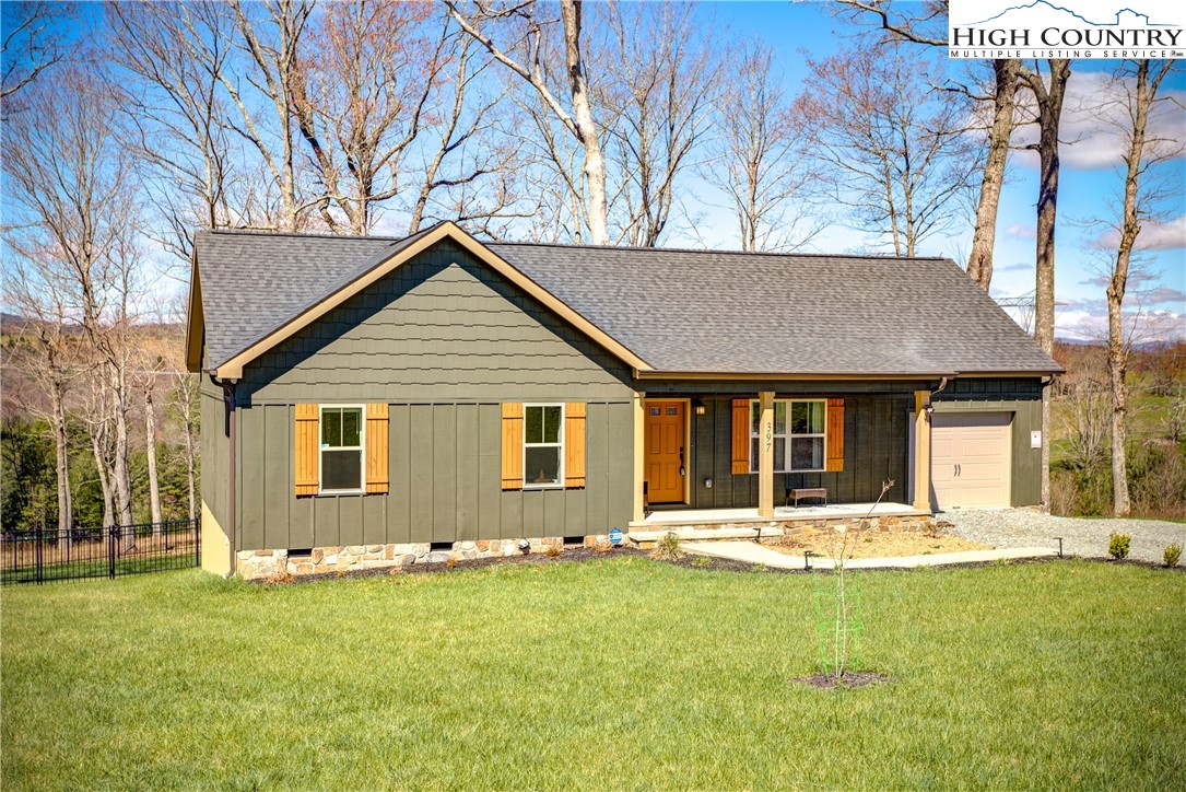 397 Turtle Ridge Road Sparta, NC 28675 - Photo 5 of 33 a front view of house with yard and green space