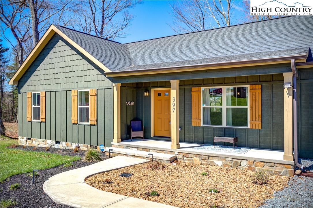 397 Turtle Ridge Road Sparta, NC 28675 - Photo 6 of 33 a house view with a outdoor space
