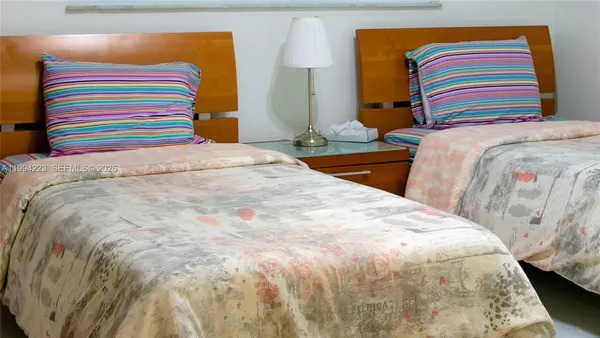 a bedroom with a bed and a small place