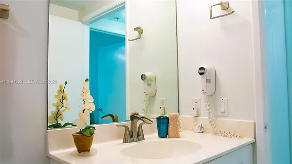 a bathroom with a sink and a mirror