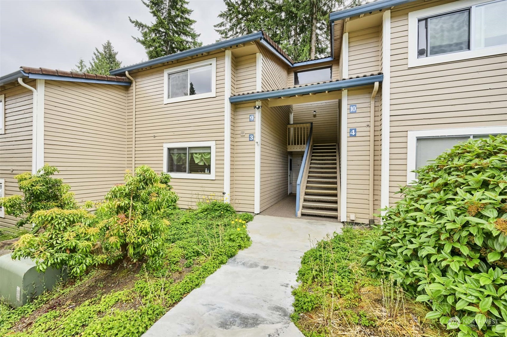17536 149th Avenue Southeast, Unit O 9 Renton, WA 98058 - Photo 1 of 20 a view of a house with a yard and plants