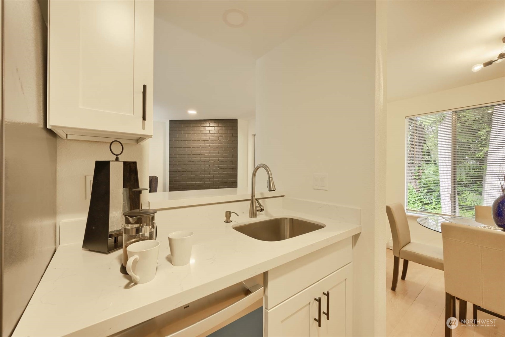 17536 149th Avenue Southeast, Unit O 9 Renton, WA 98058 - Photo 12 of 20 a view of a kitchen with a sink and a large window