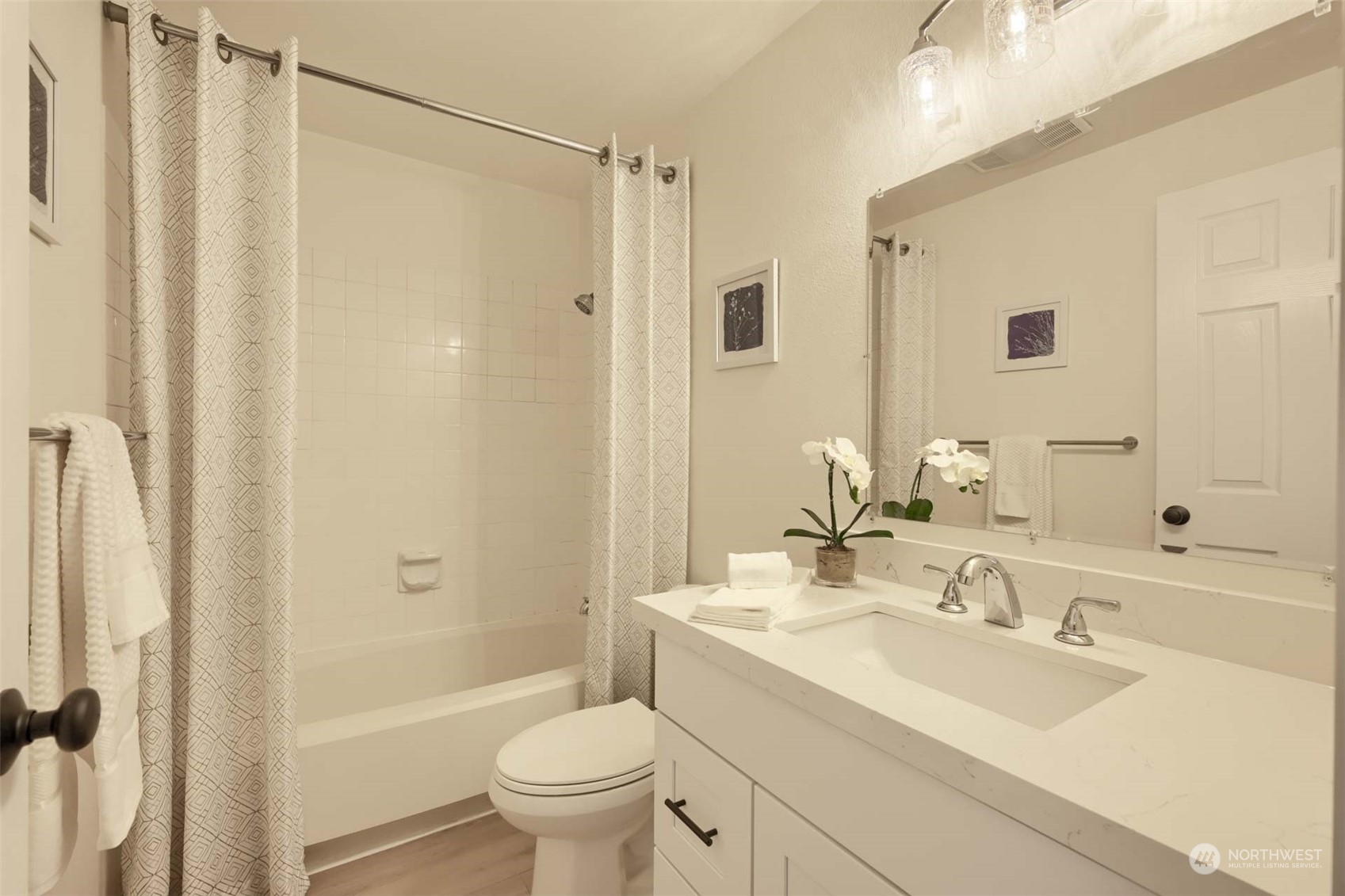 17536 149th Avenue Southeast, Unit O 9 Renton, WA 98058 - Photo 17 of 20 a bathroom with a sink toilet and shower