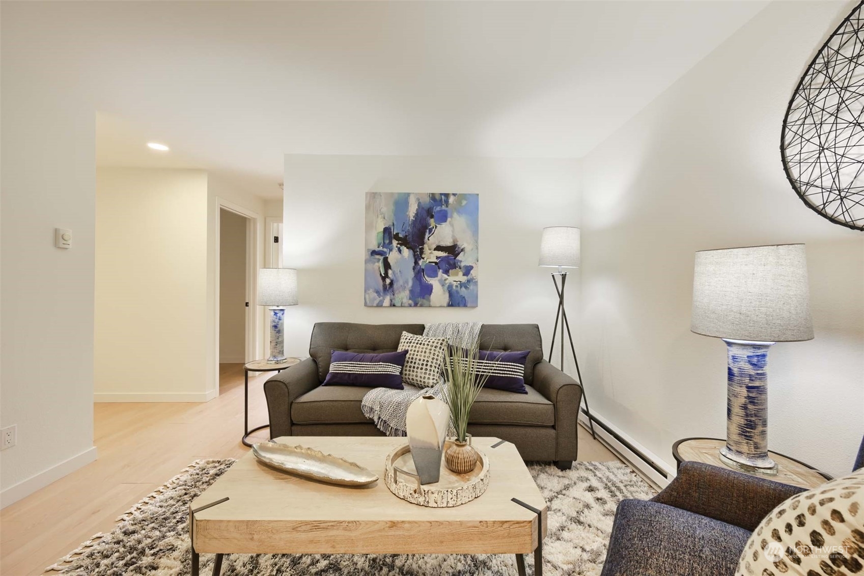 17536 149th Avenue Southeast, Unit O 9 Renton, WA 98058 - Photo 2 of 20 a living room with furniture and a lamp