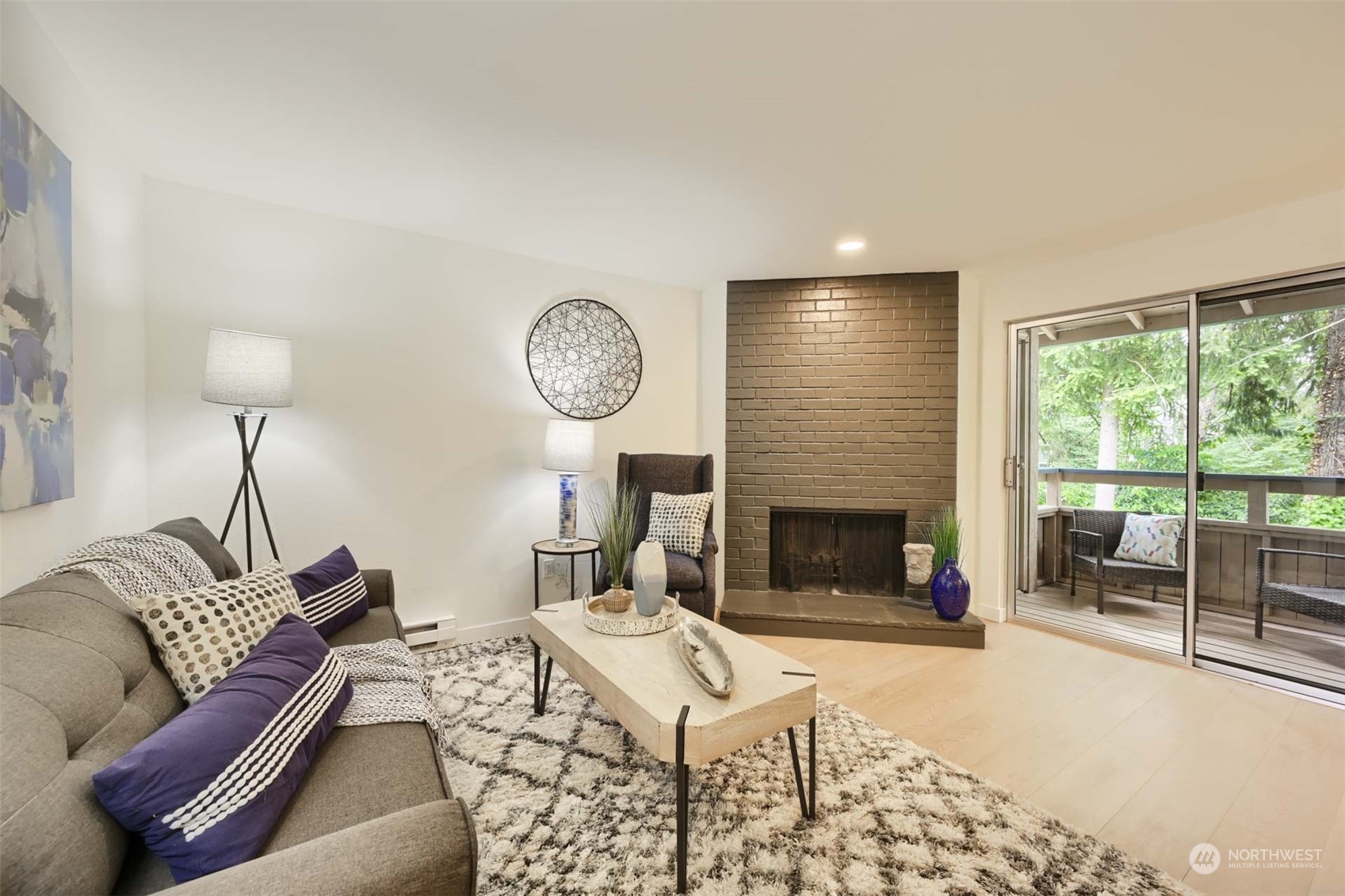 17536 149th Avenue Southeast, Unit O 9 Renton, WA 98058 - Photo 3 of 20 a living room with furniture a window and a fireplace