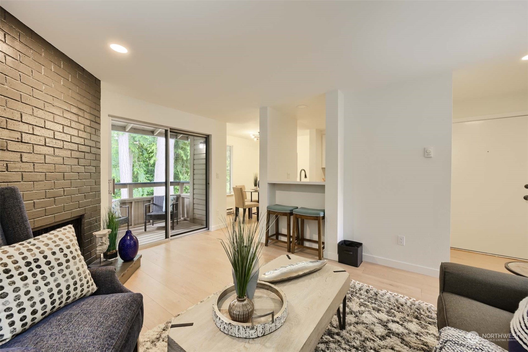 17536 149th Avenue Southeast, Unit O 9 Renton, WA 98058 - Photo 7 of 20 a living room with furniture and a floor to ceiling window