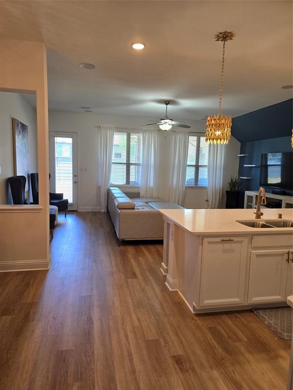 7024 Tree Stand Point Little Elm, TX 76227 - Photo 6 of 30 a living room with furniture and a chandelier