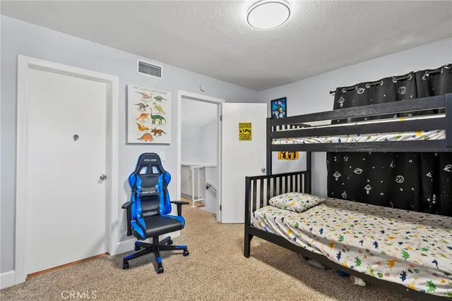 a bedroom with furniture and a window