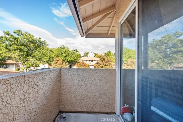 a view of a balcony with wooden floor