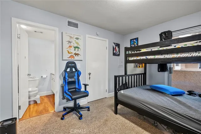 a bedroom with furniture and a window