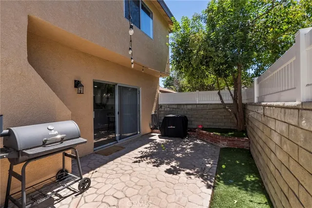 a view of house with outdoor seating area