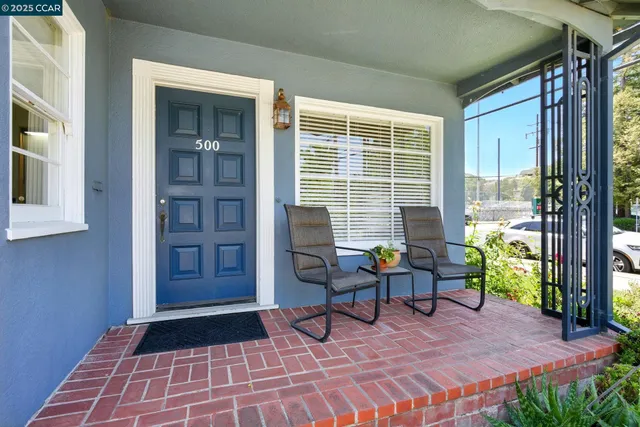 a living room with furniture and a gate