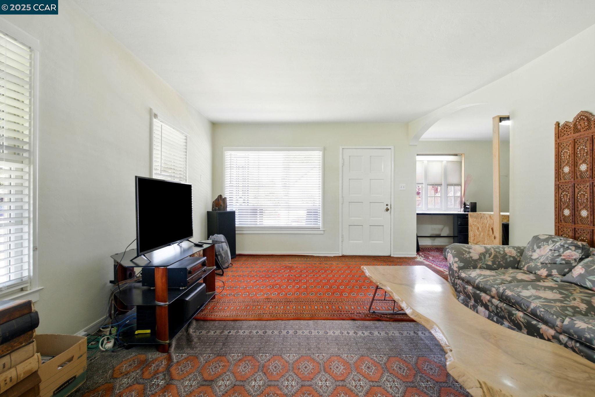 500 Wano Street Martinez, CA 94553 - Photo 11 of 30 a living room with furniture and a flat screen tv