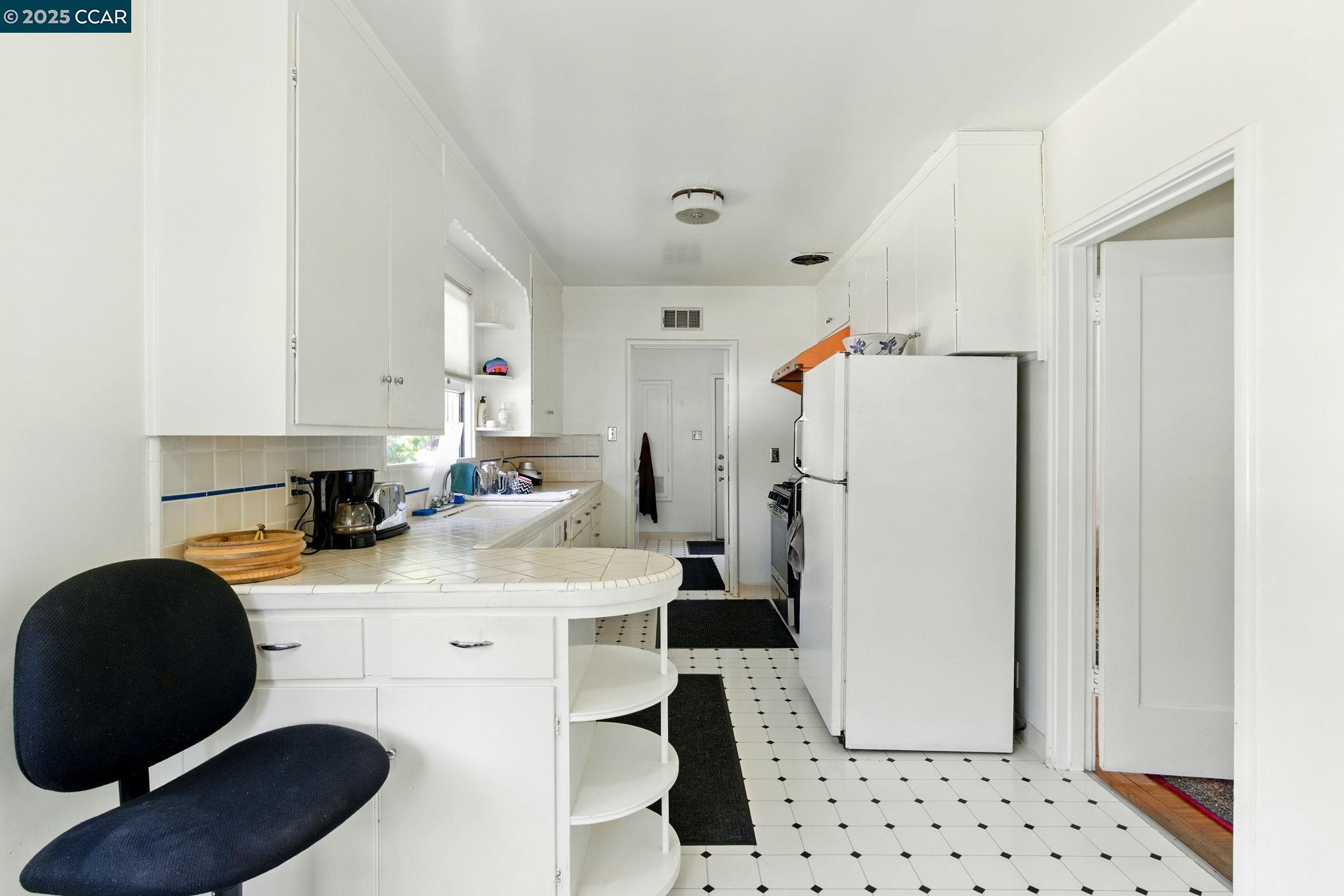 500 Wano Street Martinez, CA 94553 - Photo 14 of 30 a kitchen with stainless steel appliances a refrigerator a sink a stove a microwave and cabinets
