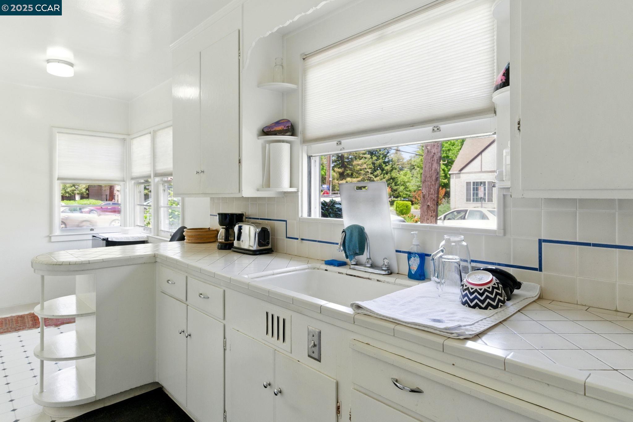 500 Wano Street Martinez, CA 94553 - Photo 17 of 30 a kitchen with a white cabinets and window