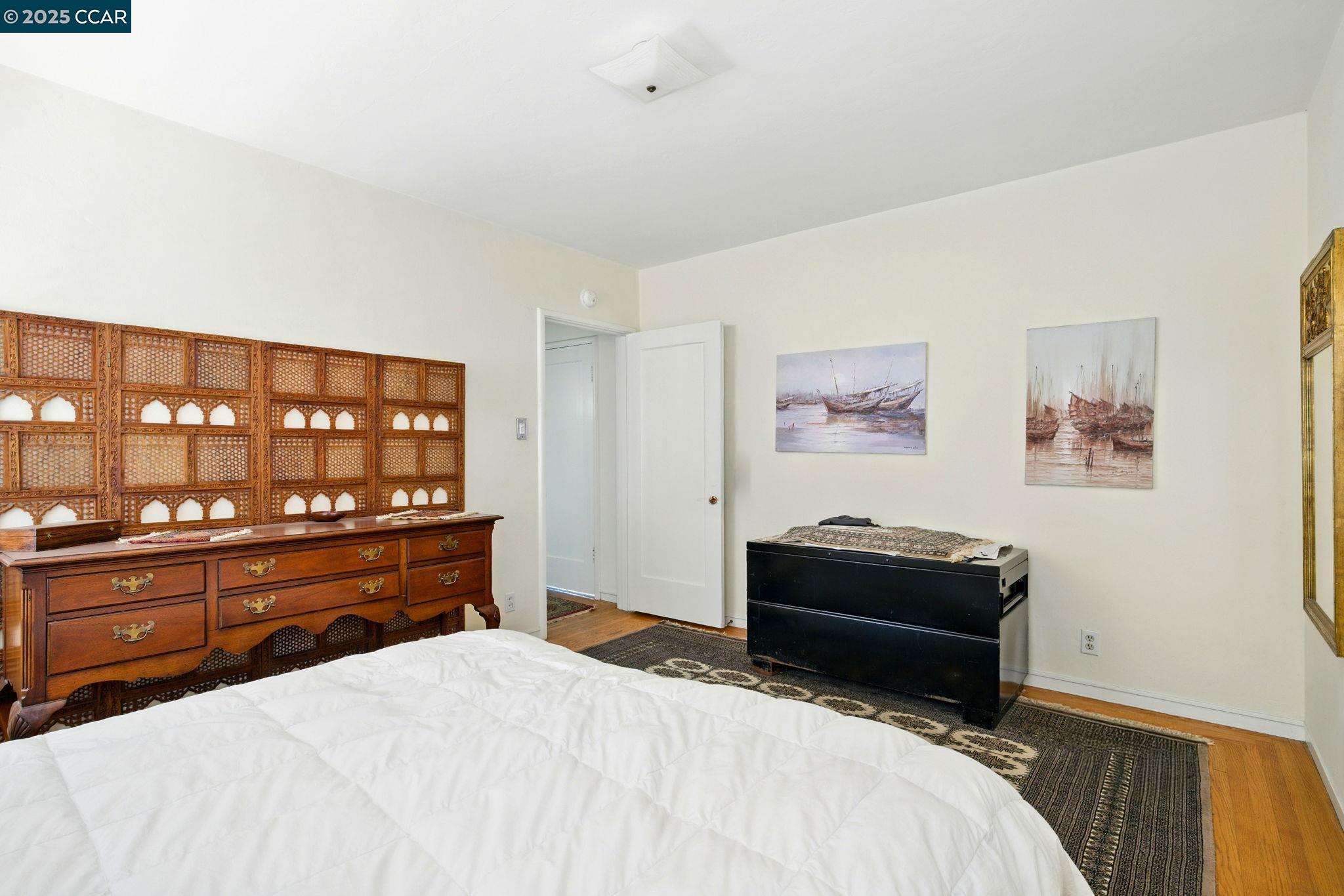 500 Wano Street Martinez, CA 94553 - Photo 21 of 30 a bedroom with a bed and dresser