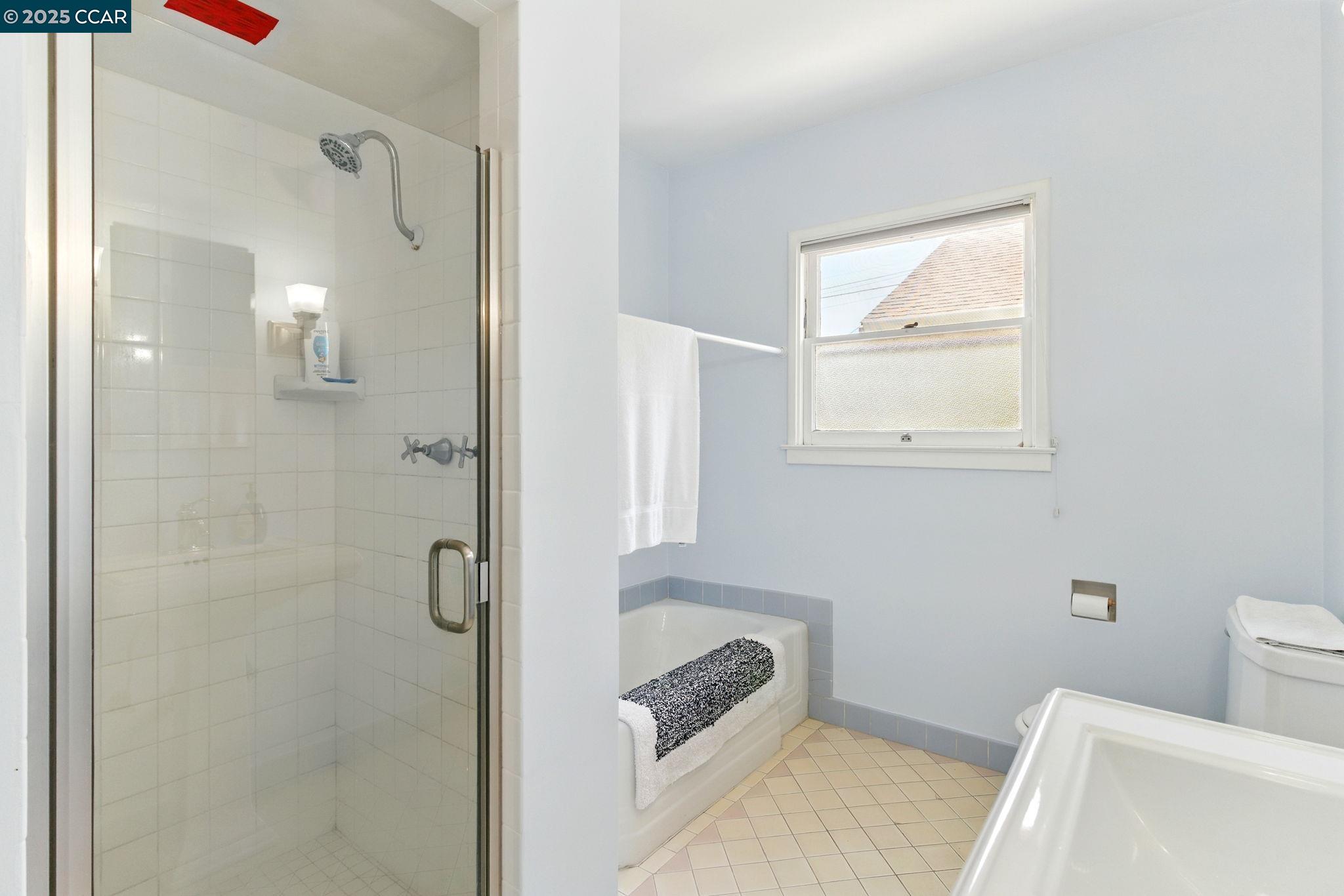 500 Wano Street Martinez, CA 94553 - Photo 24 of 30 a bathroom with a tub shower and sink