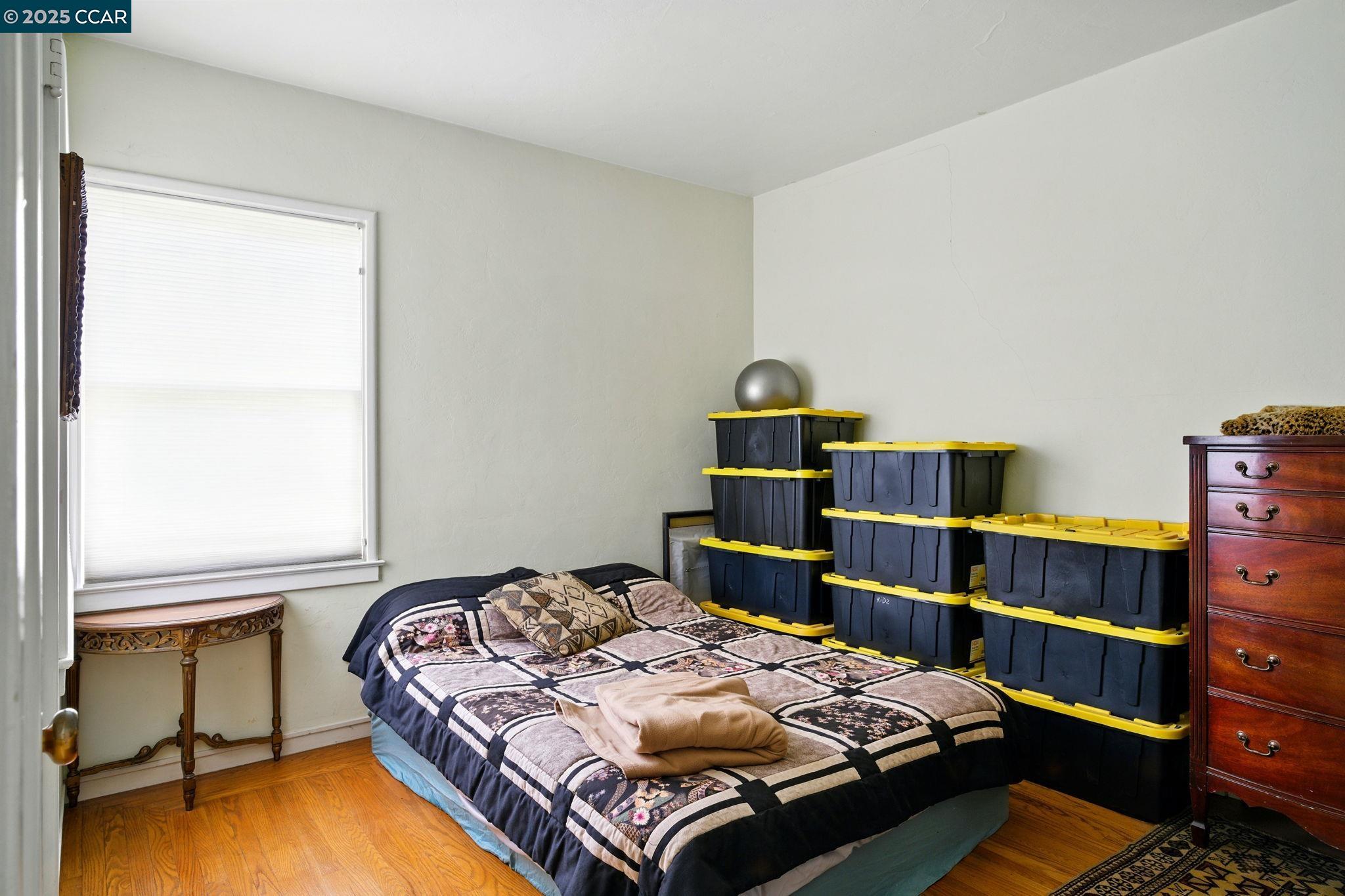 500 Wano Street Martinez, CA 94553 - Photo 26 of 30 a bedroom with a bed and chair