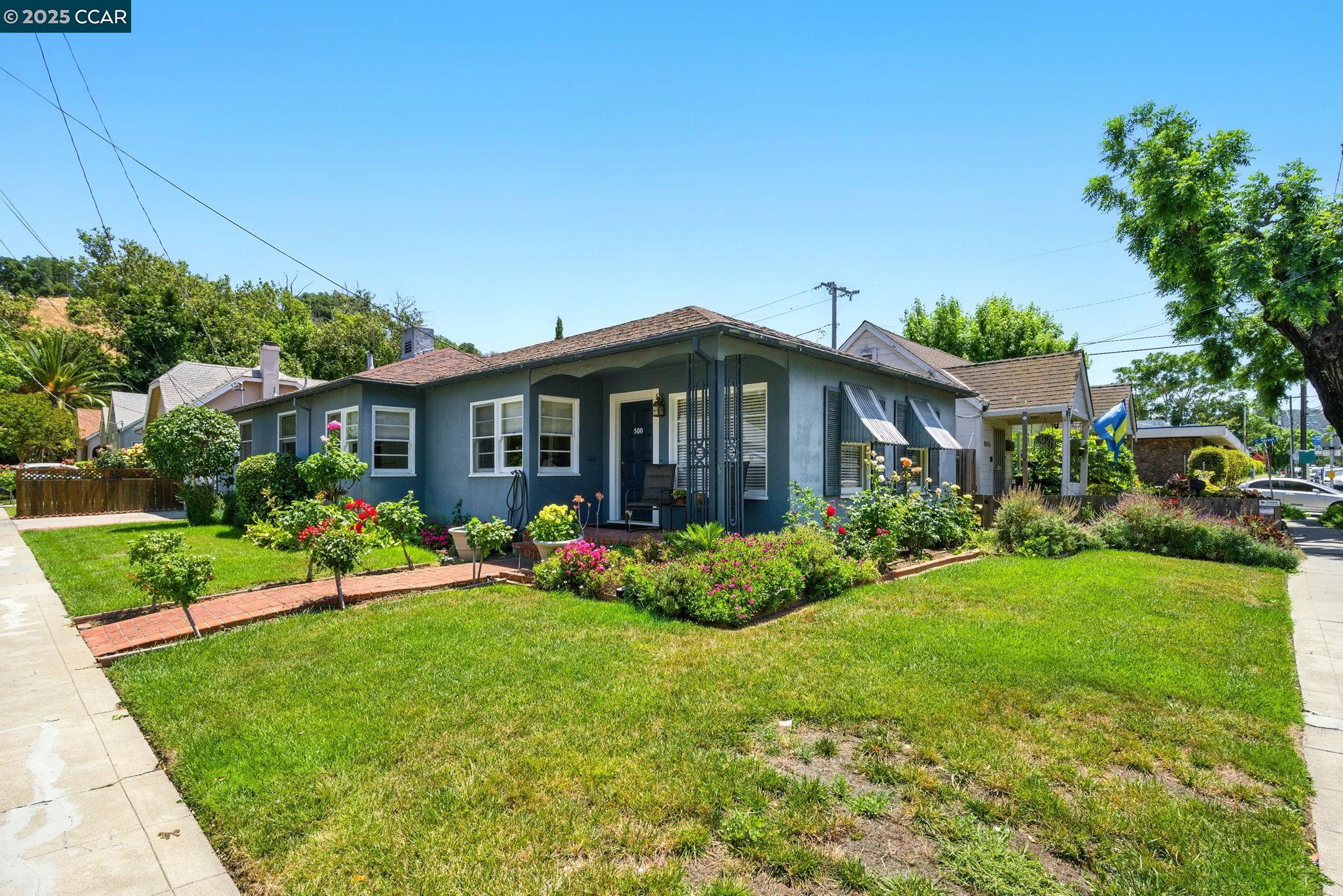 500 Wano Street Martinez, CA 94553 - Photo 4 of 30 a front view of a house with a garden and plants