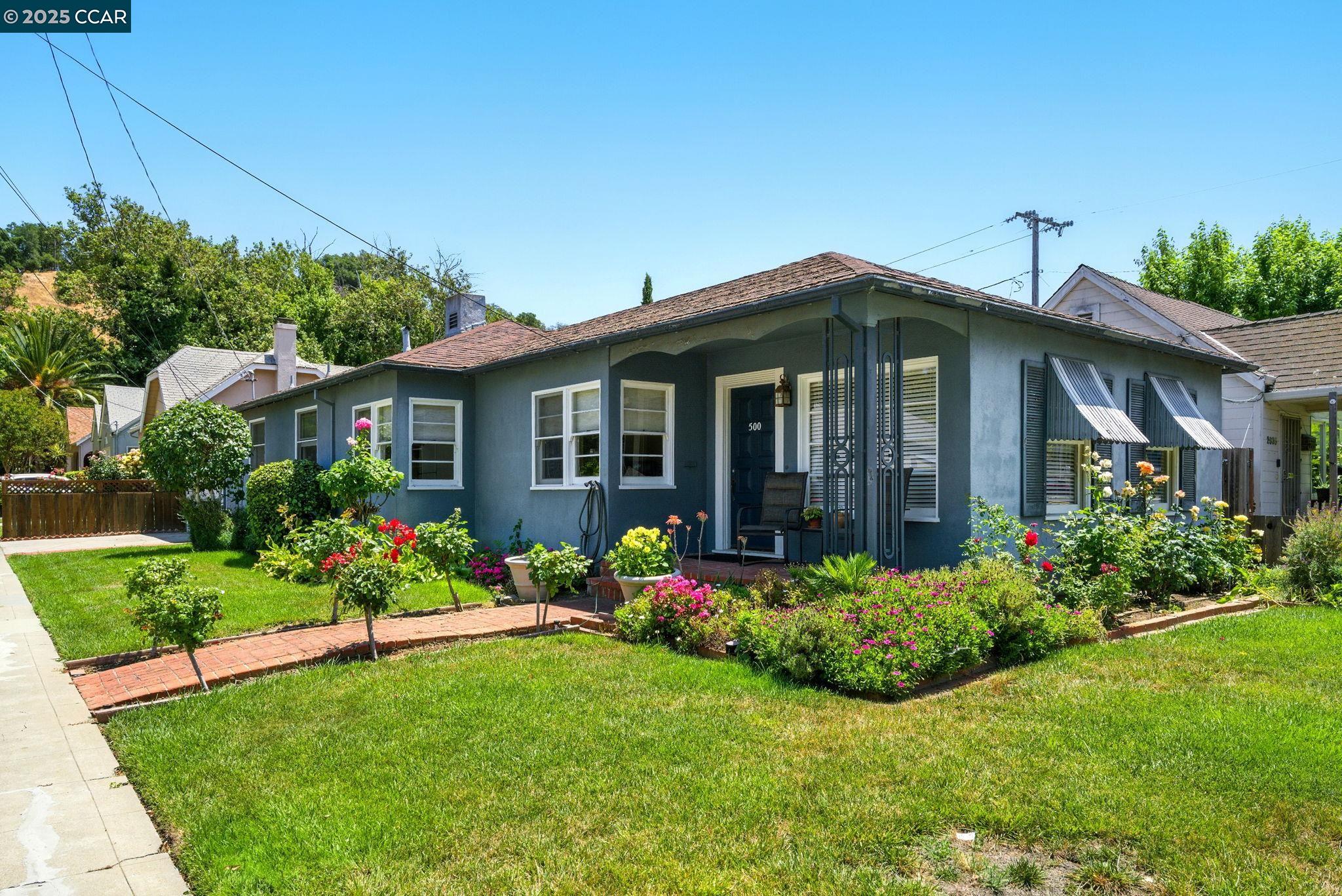 500 Wano Street Martinez, CA 94553 - Photo 5 of 30 a front view of a house with a garden