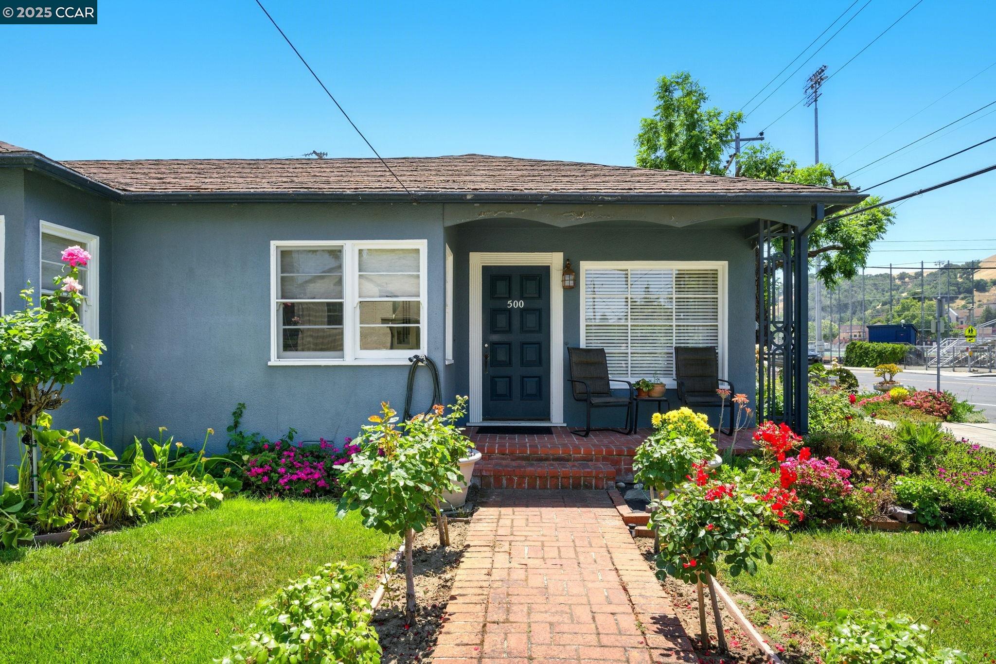 500 Wano Street Martinez, CA 94553 - Photo 6 of 30 a front view of a house with a yard
