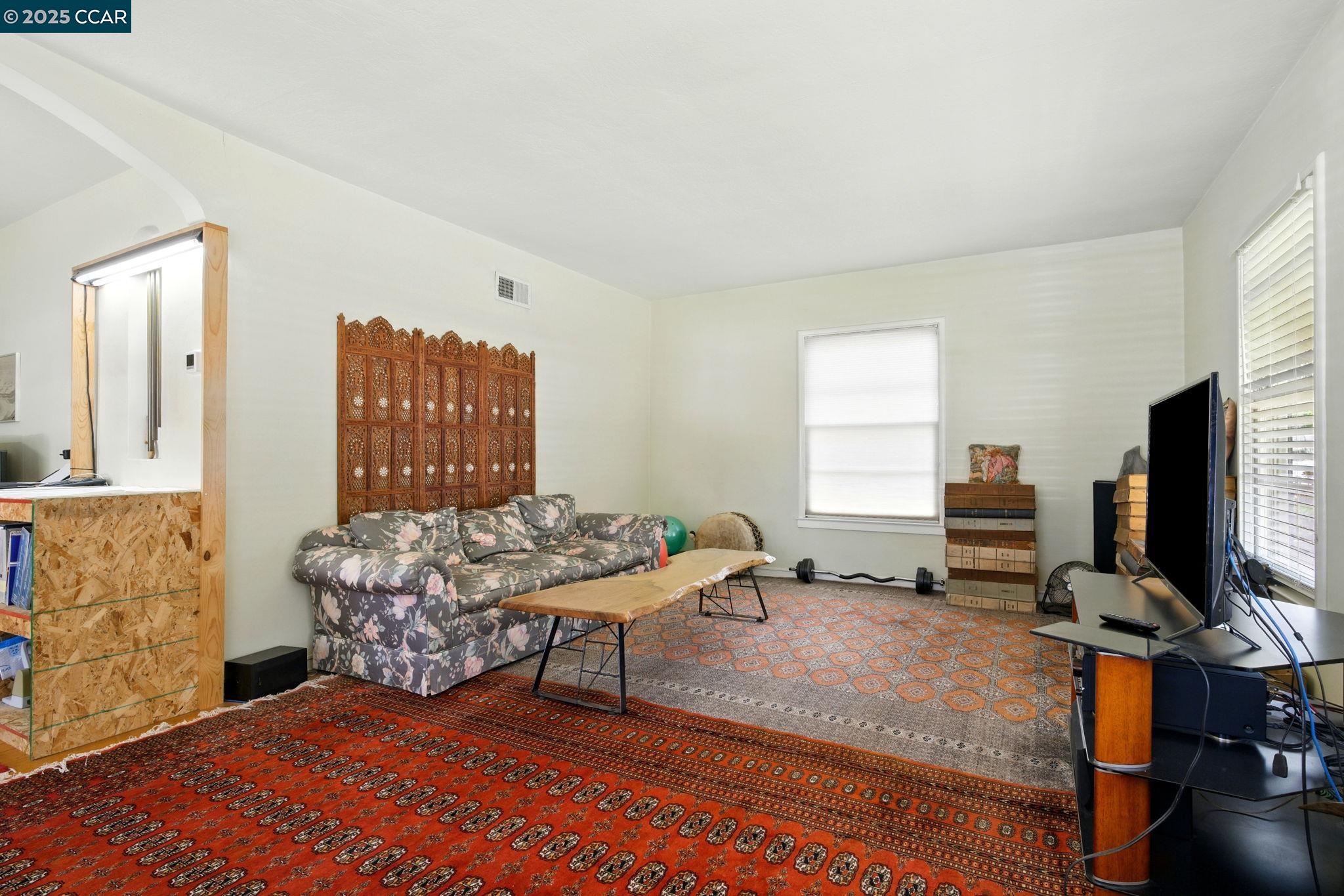 500 Wano Street Martinez, CA 94553 - Photo 7 of 30 a bedroom with furniture and a flat screen tv