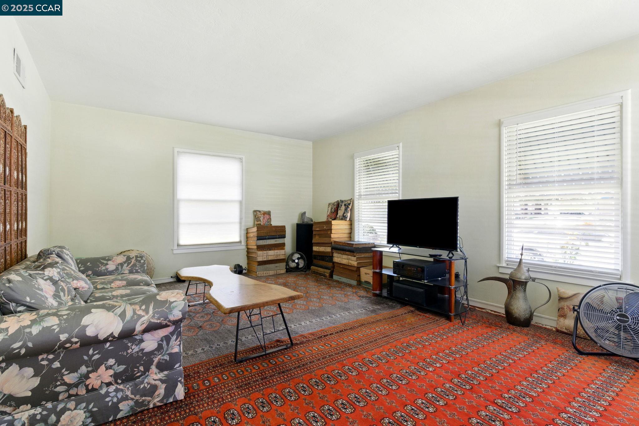 500 Wano Street Martinez, CA 94553 - Photo 9 of 30 a living room with furniture and a flat screen tv
