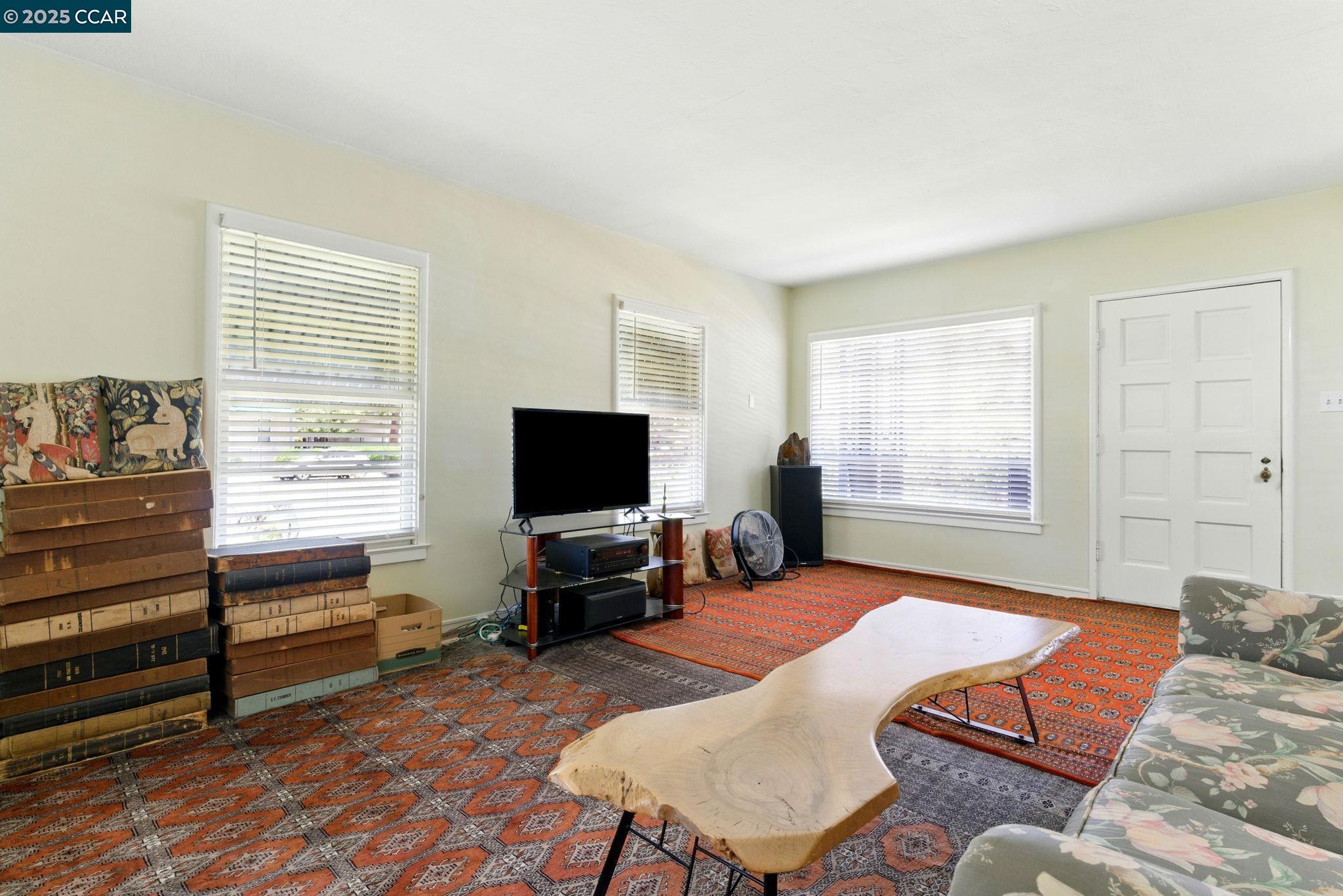 500 Wano Street Martinez, CA 94553 - Photo 10 of 30 a living room with furniture and a flat screen tv