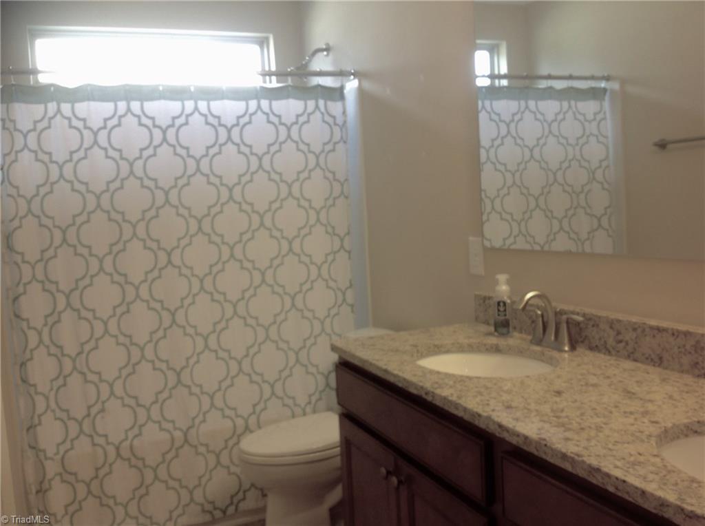 3406 Lamplight Way High Point, NC 27265 - Photo 20 of 29 Upstairs bath with double bowl vanity.