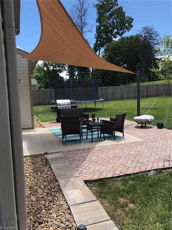 3406 Lamplight Way High Point, NC 27265 - Photo 24 of 29 Patio with Custom Shade that resists high winds. Only needs to be removed before we have a snowy day and it unclips easily.
