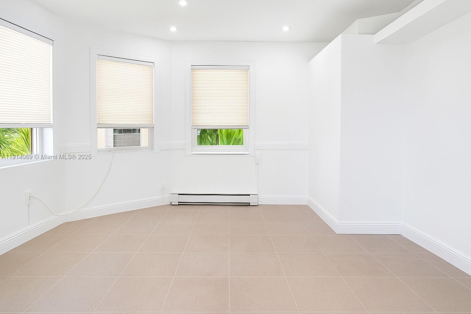 an empty room with windows