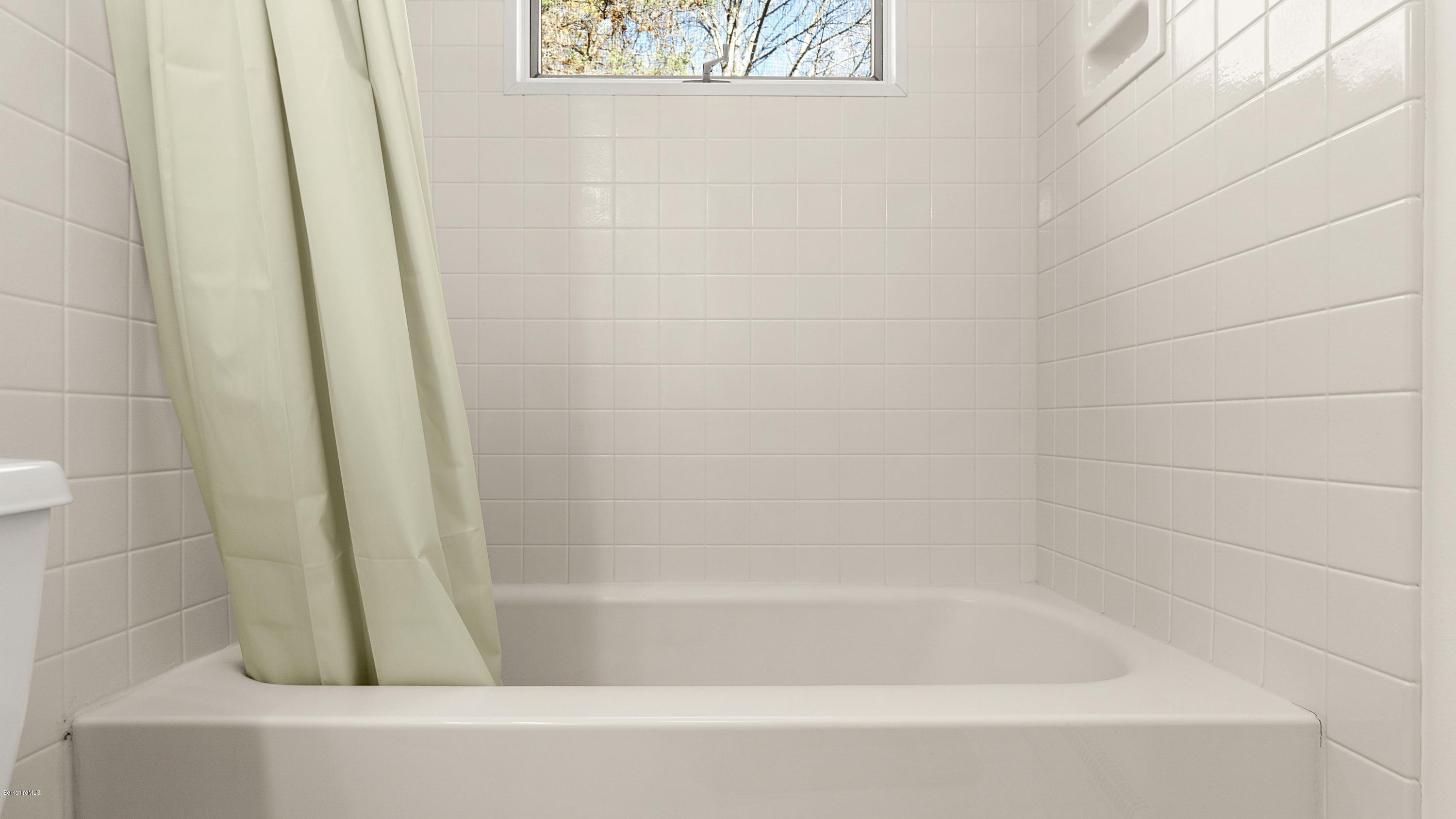 23 Interlaken Road Stockbridge, MA 01266 - Photo 13 of 26 a close up of a bathtub in a bathroom