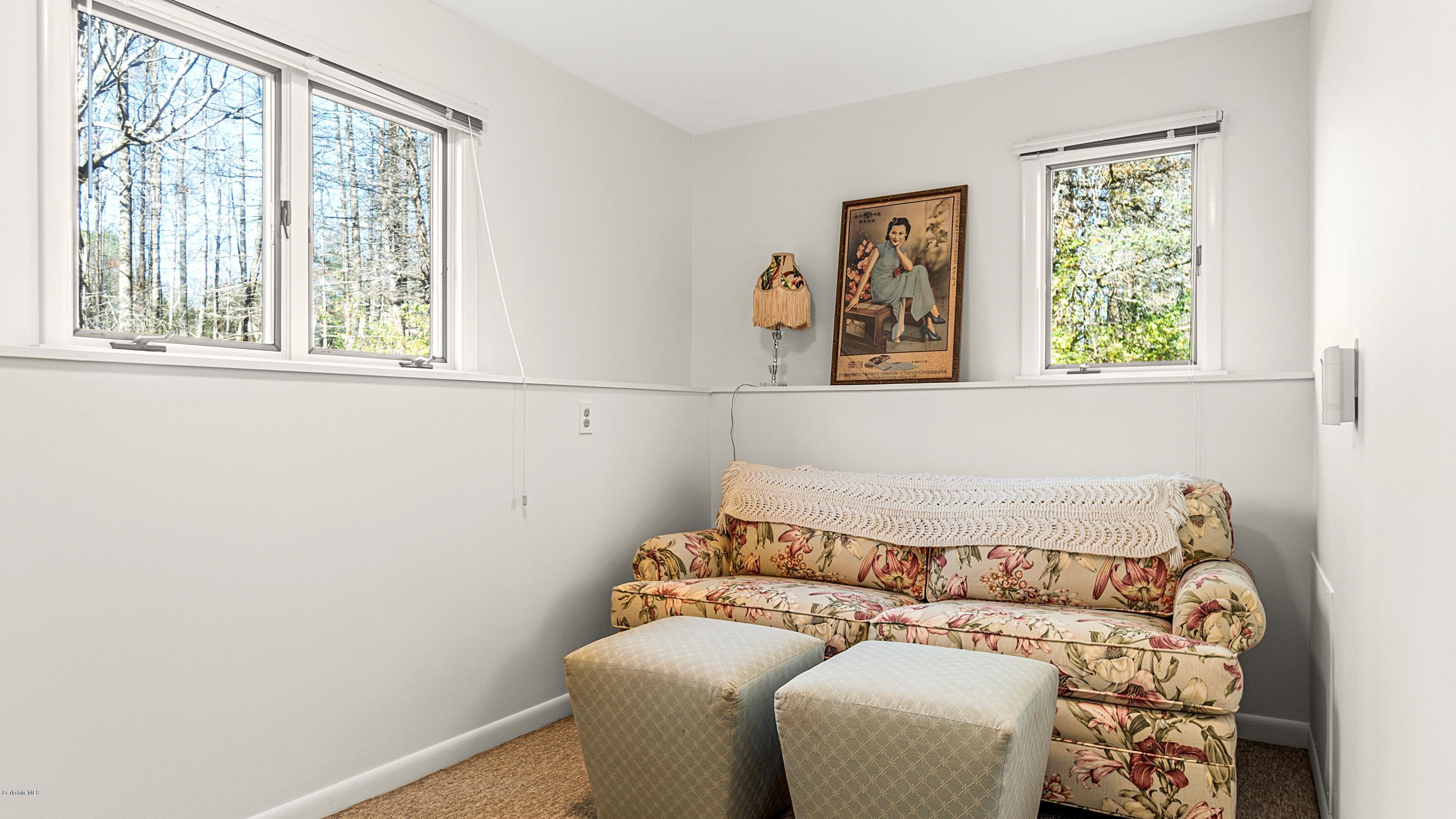 23 Interlaken Road Stockbridge, MA 01266 - Photo 16 of 26 a bed sitting in a bedroom next to a window