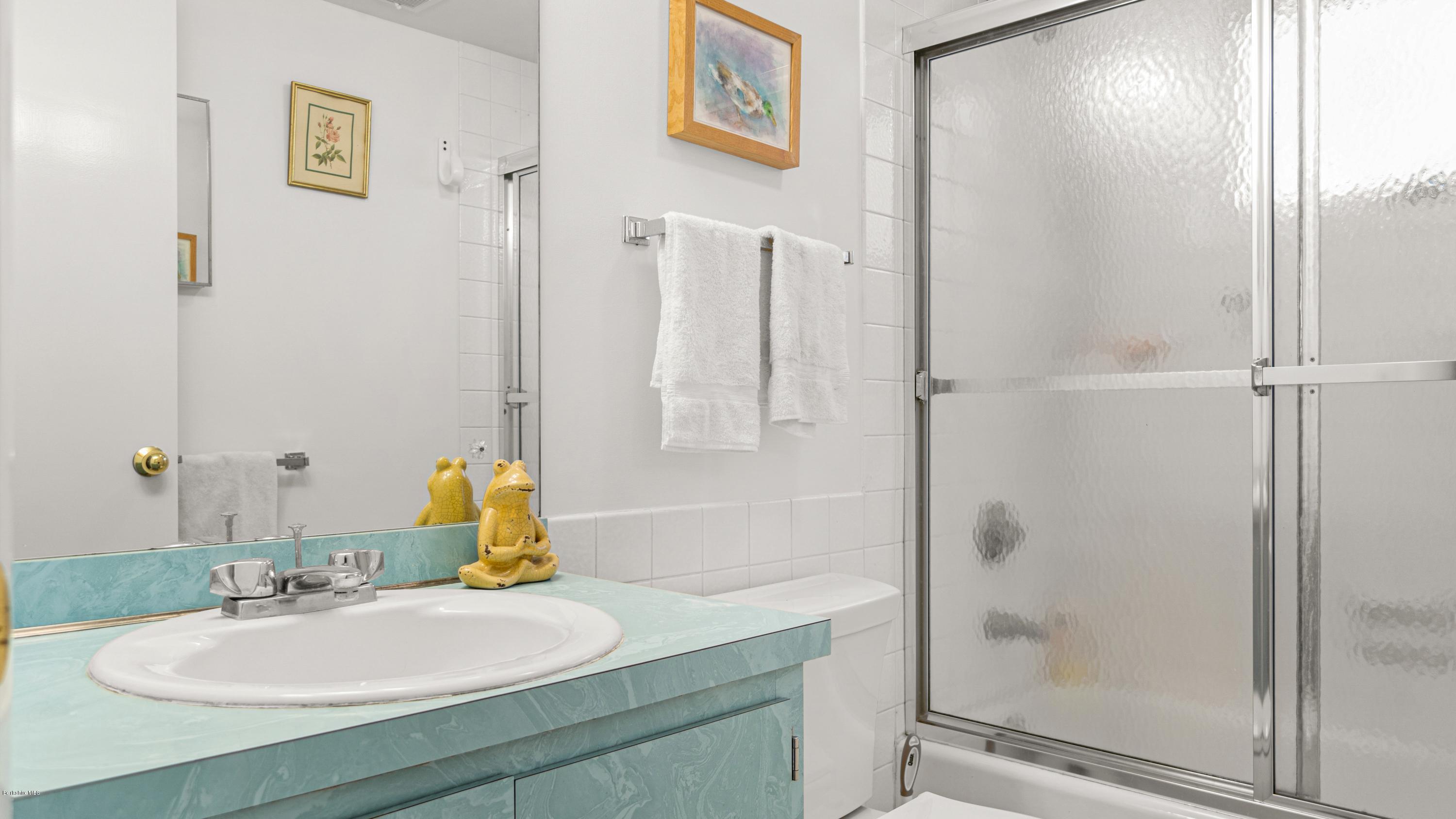 23 Interlaken Road Stockbridge, MA 01266 - Photo 17 of 26 a bathroom with a sink and a mirror