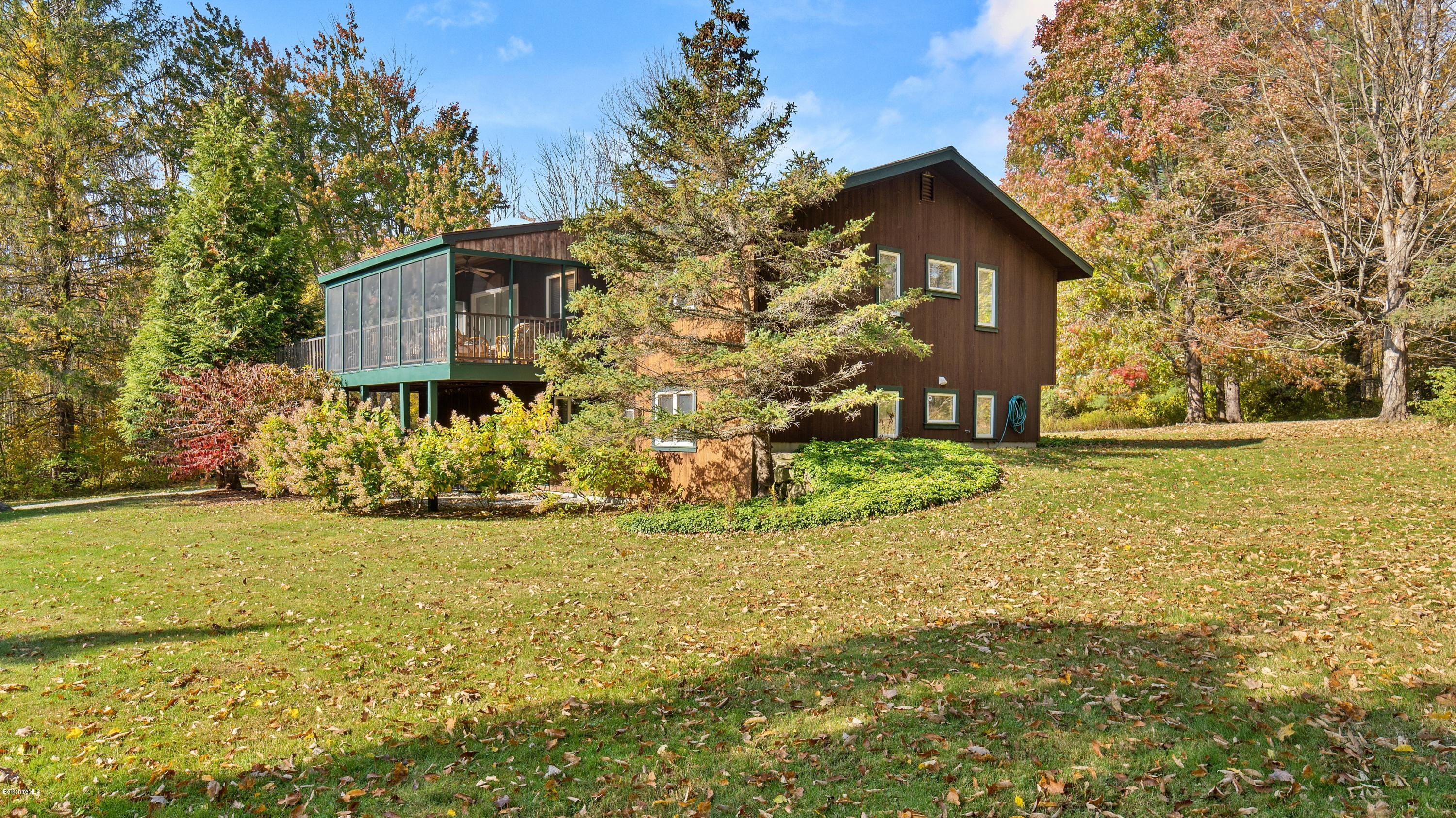 23 Interlaken Road Stockbridge, MA 01266 - Photo 23 of 26 a view of a house with backyard and tree