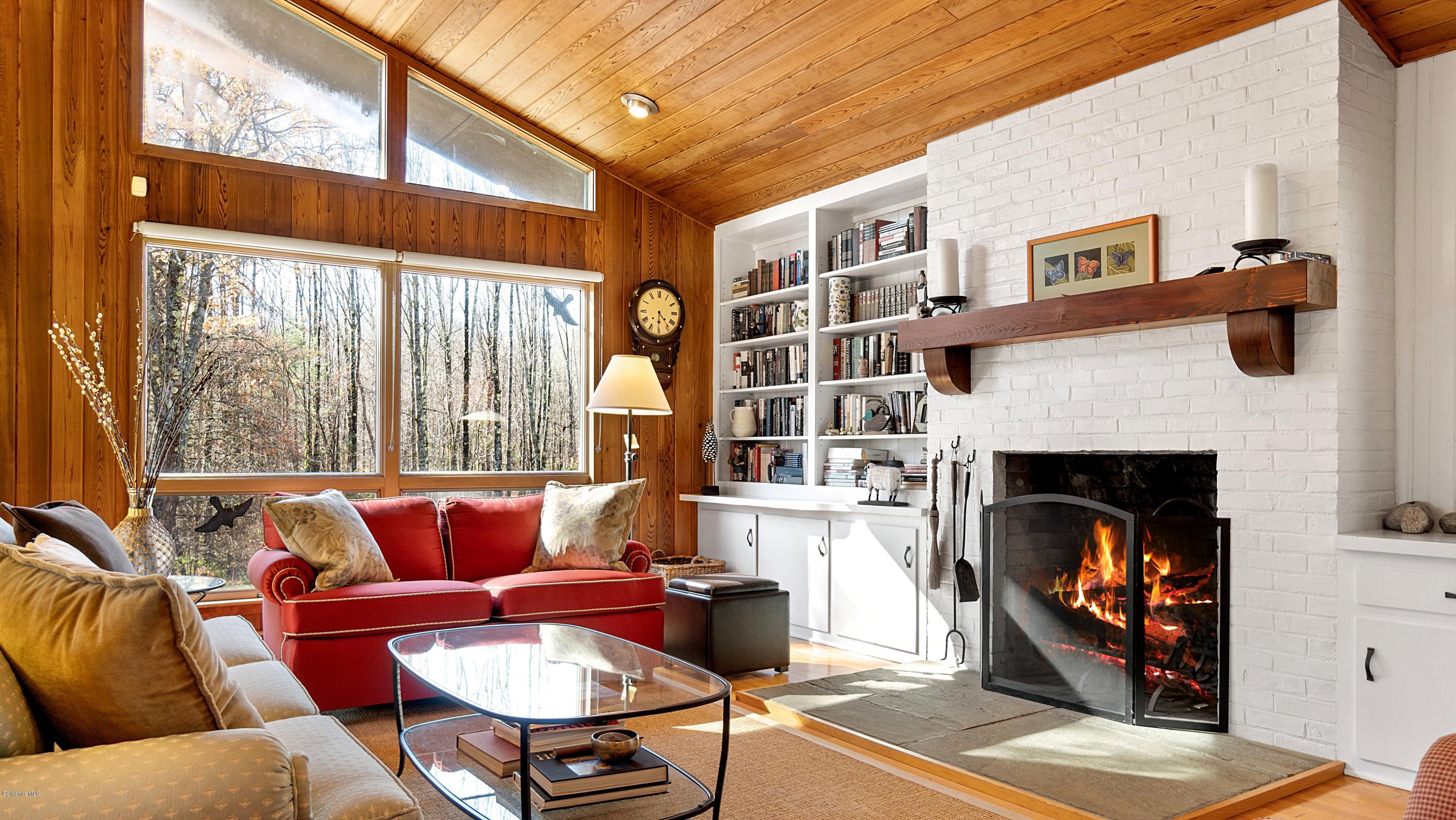 23 Interlaken Road Stockbridge, MA 01266 - Photo 6 of 26 a living room with furniture and a fireplace